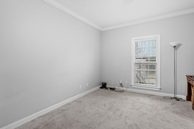 carpeted empty room with crown molding