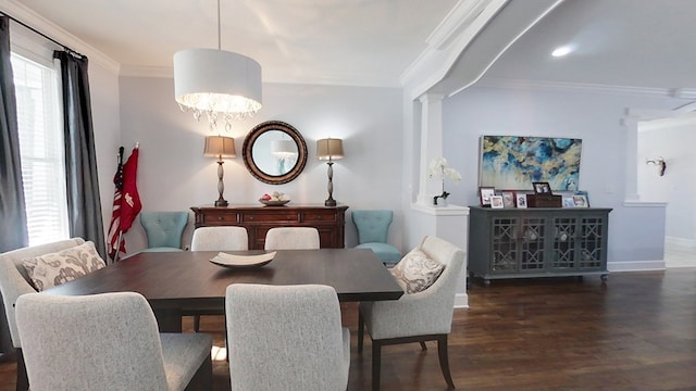 dining space featuring dark hardwood / wood-style flooring, an inviting chandelier, and crown molding