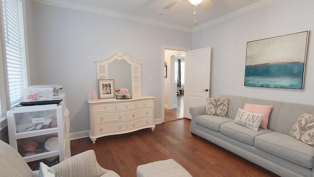 living room with ceiling fan, ornamental molding, and dark wood-type flooring