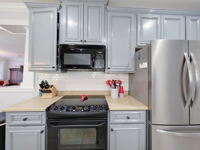 kitchen with black appliances, decorative backsplash, and ornamental molding