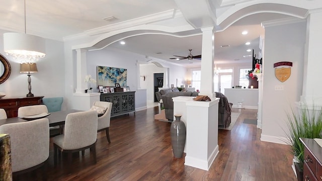 interior space with dark hardwood / wood-style flooring, ceiling fan, and crown molding