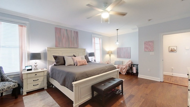 bedroom featuring dark hardwood / wood-style floors, multiple windows, and ornamental molding