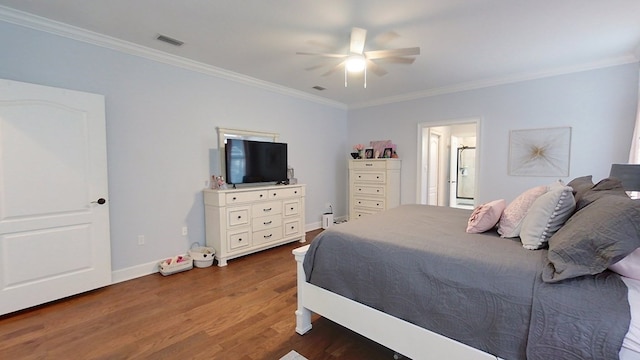 bedroom with ceiling fan, dark wood-type flooring, and ornamental molding