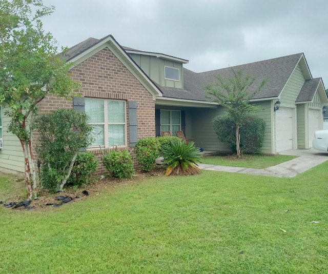 view of front facade with a front yard and a garage