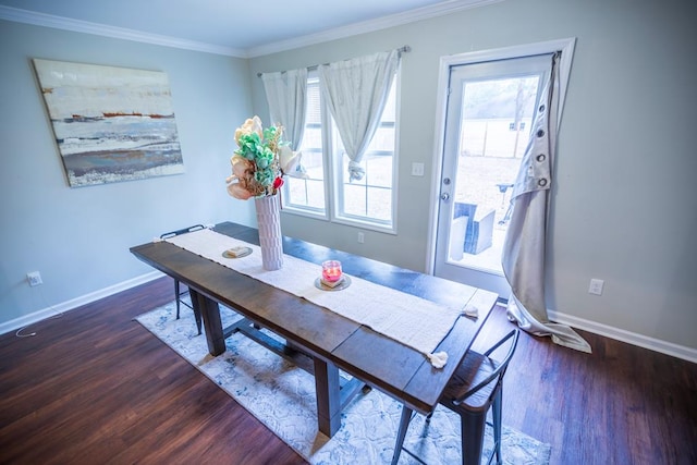 dining area featuring dark hardwood / wood-style floors and ornamental molding