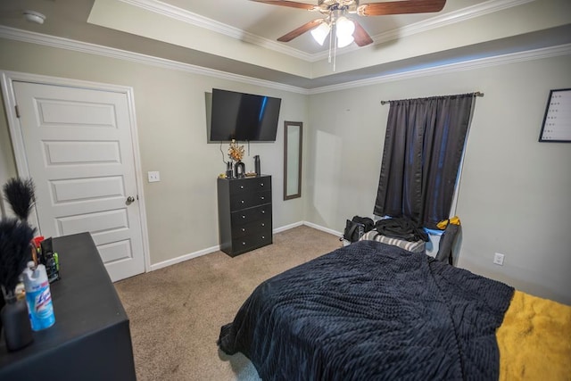 bedroom featuring light carpet, a raised ceiling, ceiling fan, and ornamental molding