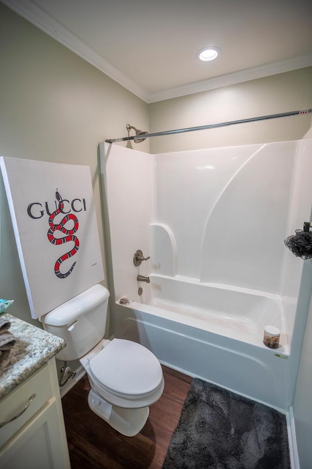 full bathroom featuring vanity, crown molding, shower / bathing tub combination, hardwood / wood-style flooring, and toilet