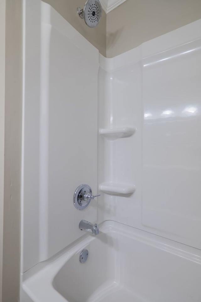 bathroom with washtub / shower combination