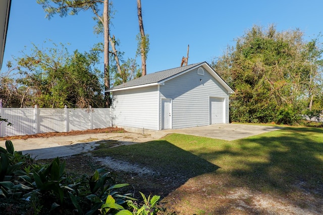 garage with a lawn