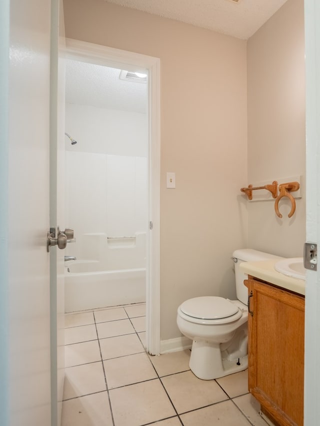 full bathroom with shower / tub combination, tile patterned flooring, vanity, and toilet