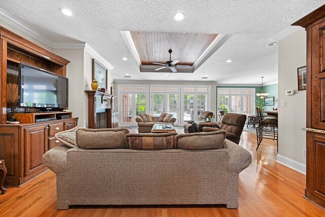 4155 Quail Run Cir, Valdosta, GA 31601 - living room featuring healthy amount of natural light, ornamental molding, light wood-type flooring, ceiling fan, and a textured ceiling