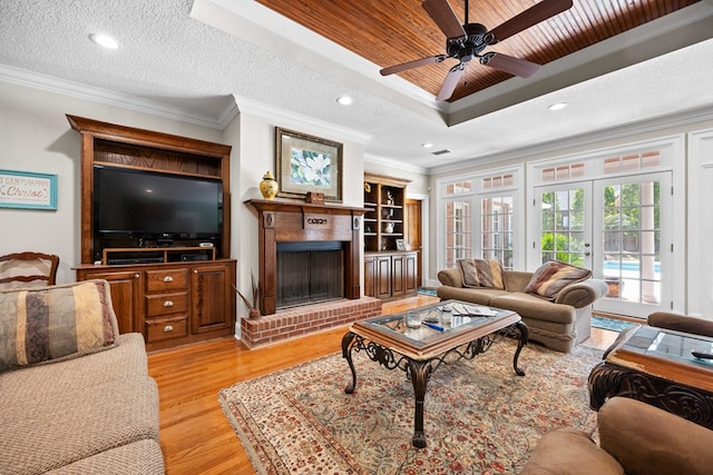 4155 Quail Run Cir, Valdosta, GA 31601 - living room with ornamental molding, a fireplace, light wood finished floors, ceiling fan, and recessed lighting
