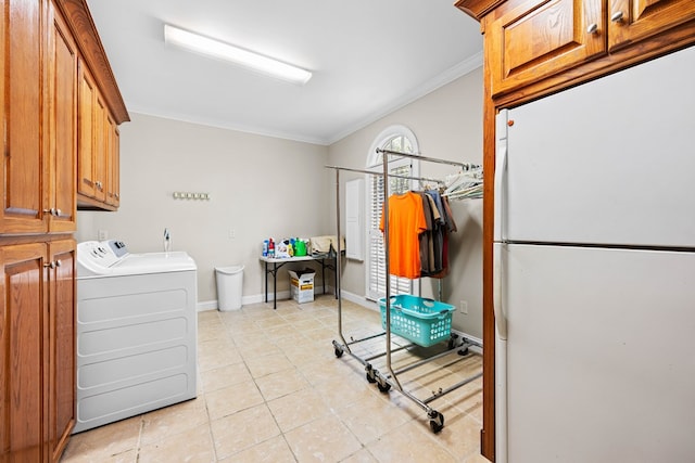 4155 Quail Run Cir, Valdosta, GA 31601 - laundry room with washing machine and dryer, crown molding, cabinet space, and light tile patterned floors