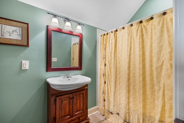 4155 Quail Run Cir, Valdosta, GA 31601 - bathroom featuring vanity, a shower with shower curtain, and vaulted ceiling