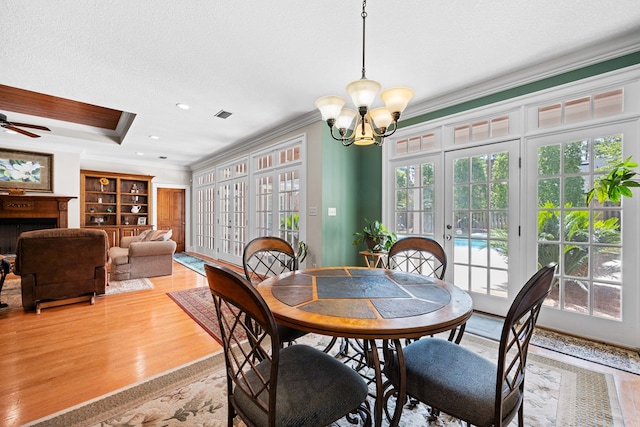 4155 Quail Run Cir, Valdosta, GA 31601 - dining room with ornamental molding, light wood-style floors, a chandelier, french doors, and ceiling fan