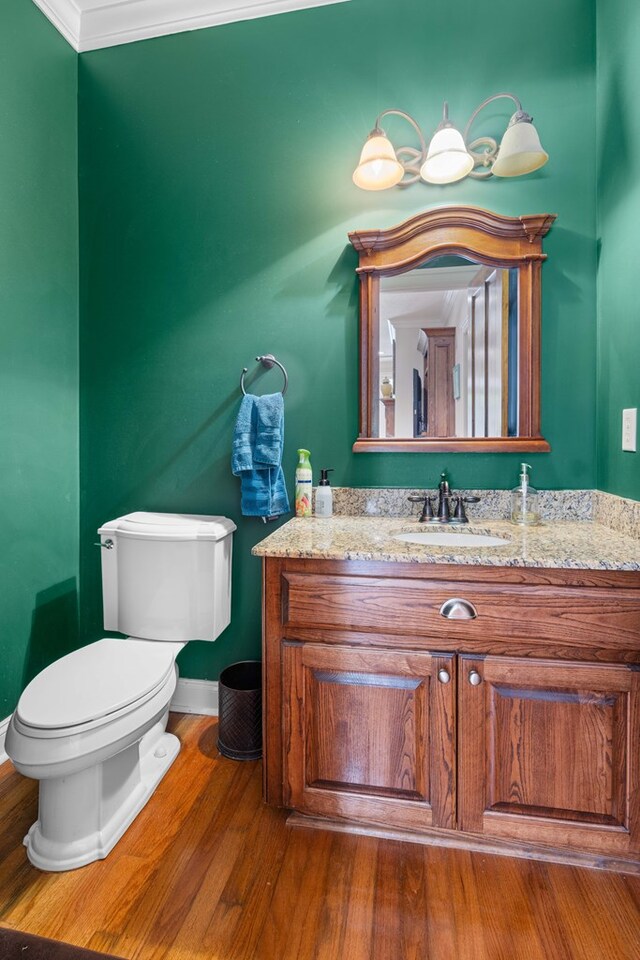 4155 Quail Run Cir, Valdosta, GA 31601 - half bath with vanity, wood finished floors, and ornamental molding