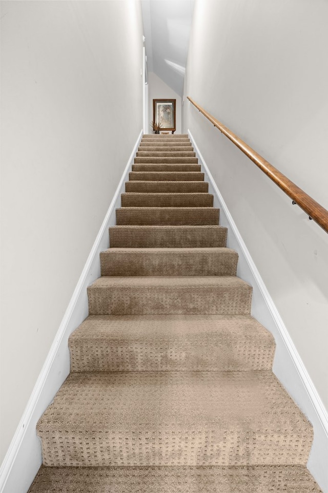 4155 Quail Run Cir, Valdosta, GA 31601 - stairway featuring lofted ceiling and baseboards