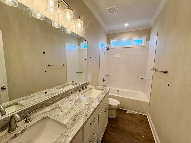 bathroom featuring visible vents, a sink, toilet, and wood finished floors