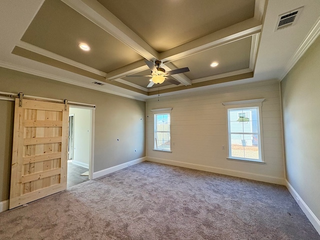 unfurnished bedroom featuring a barn door, baseboards, visible vents, coffered ceiling, and carpet