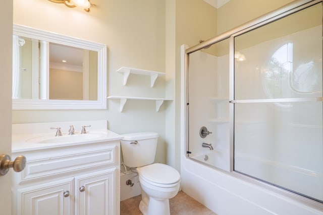 full bath with toilet, shower / bath combination with glass door, and vanity