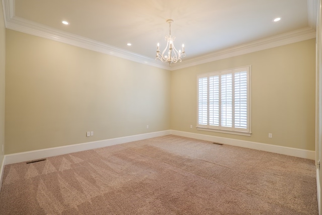 empty room featuring visible vents, crown molding, and light colored carpet