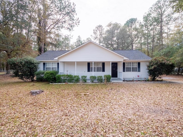 ranch-style house featuring covered porch