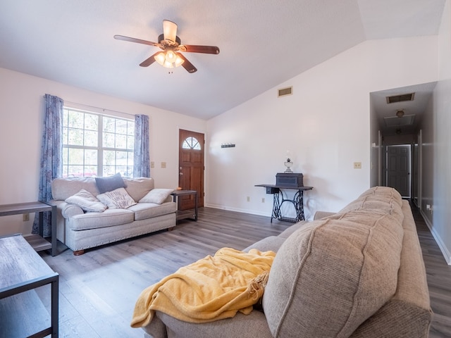 living room with lofted ceiling, hardwood / wood-style flooring, and ceiling fan