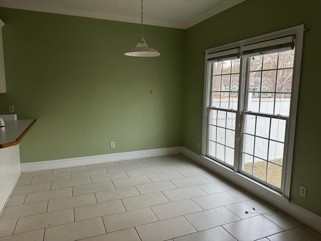 unfurnished dining area featuring light tile patterned floors and ornamental molding