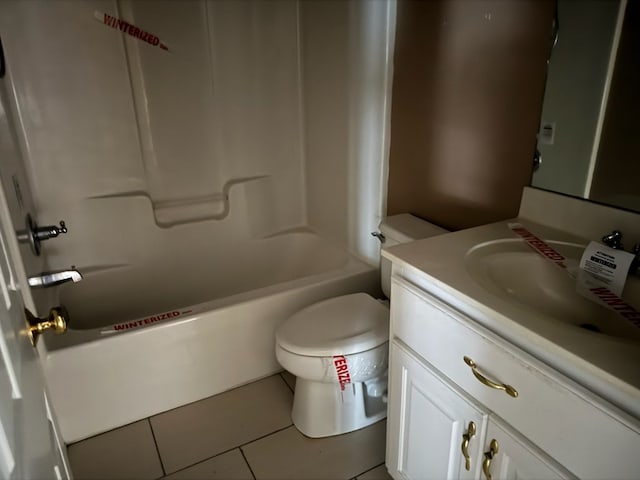 full bathroom featuring tile patterned flooring, vanity, washtub / shower combination, and toilet