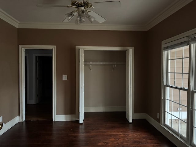 unfurnished bedroom with multiple windows, a closet, ceiling fan, and ornamental molding