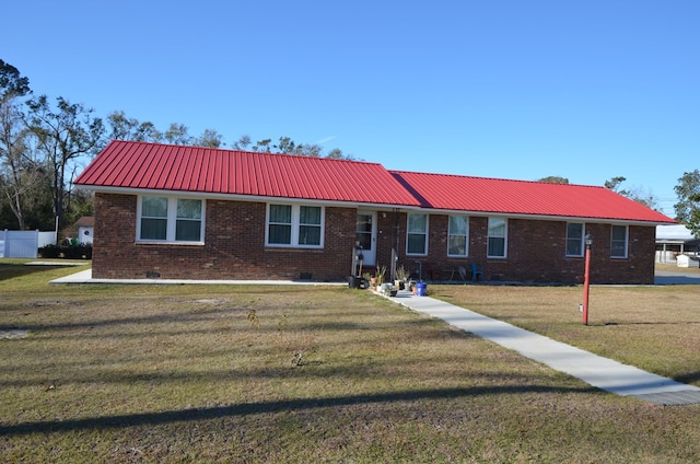 ranch-style home with a front lawn