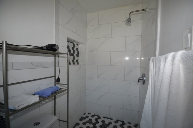 bathroom with walk in shower and toilet