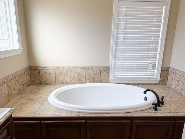 bathroom with a garden tub