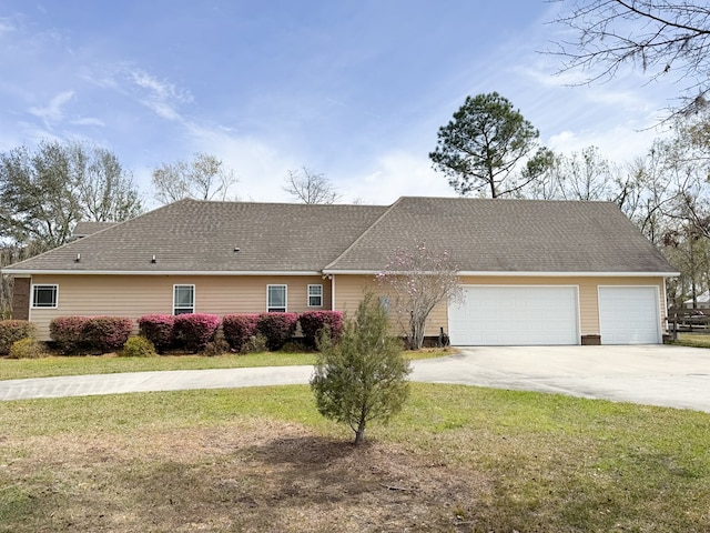 ranch-style house featuring a garage, concrete driveway, a shingled roof, and a front yard