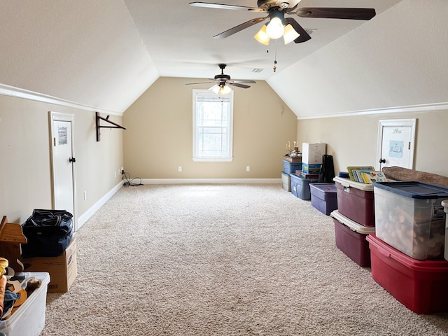 bonus room with a textured ceiling, baseboards, vaulted ceiling, and carpet flooring