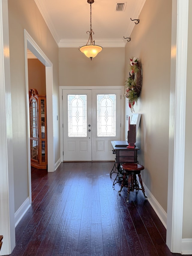 foyer entrance with french doors, visible vents, crown molding, and hardwood / wood-style floors