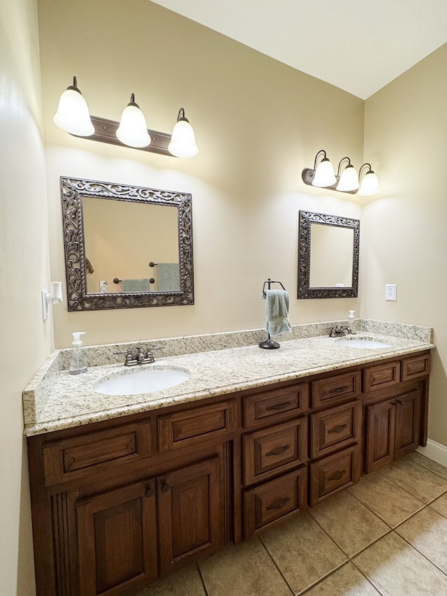 full bathroom with tile patterned floors, a sink, and double vanity