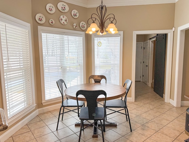 dining area featuring a chandelier, light tile patterned flooring, and baseboards