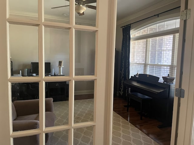 office space featuring crown molding, wood finished floors, and ceiling fan