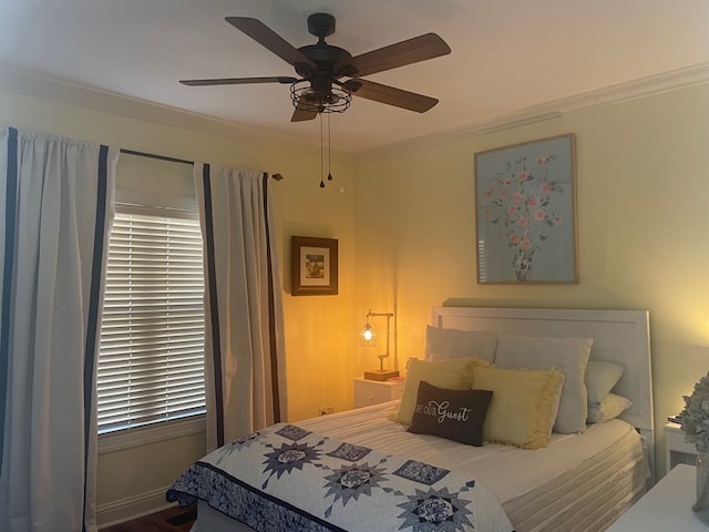 bedroom with crown molding and a ceiling fan