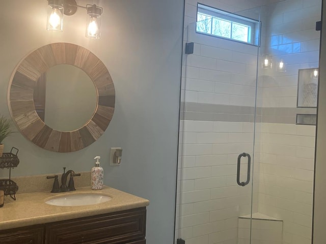 bathroom featuring vanity and a stall shower