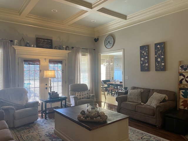 living area featuring beam ceiling, coffered ceiling, and wood finished floors