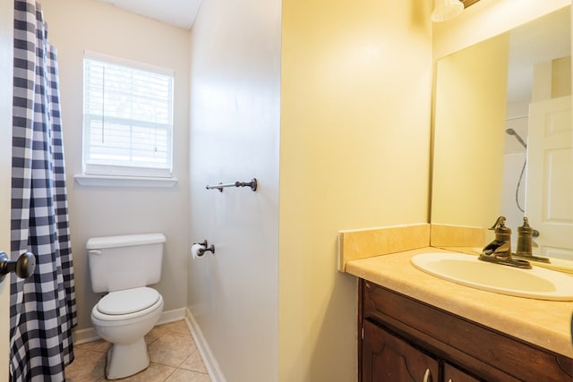 bathroom featuring vanity, a shower with shower curtain, tile patterned flooring, and toilet