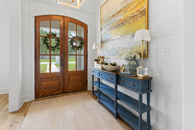 entryway featuring wood finished floors and french doors