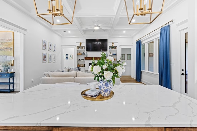dining space featuring beamed ceiling, recessed lighting, coffered ceiling, and ceiling fan with notable chandelier