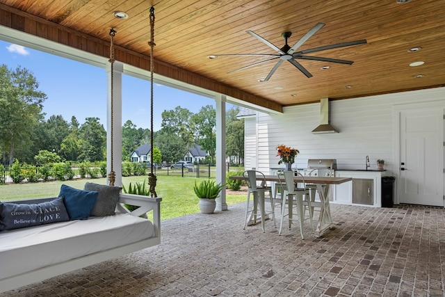view of patio with an outdoor living space, a ceiling fan, a sink, and area for grilling