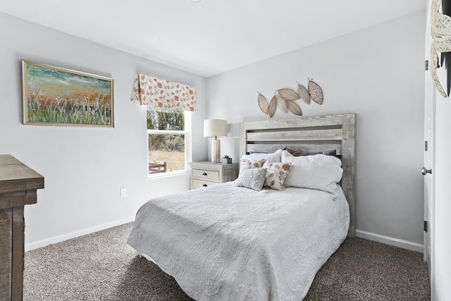 carpeted bedroom featuring baseboards