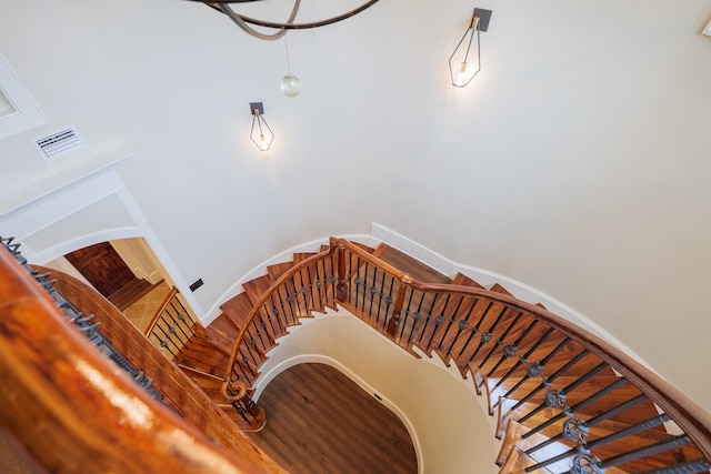 stairs with hardwood / wood-style floors