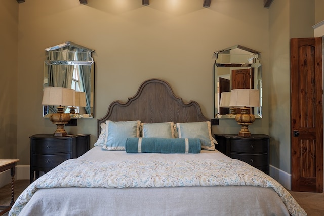 carpeted bedroom with vaulted ceiling