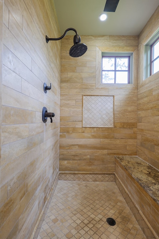 bathroom featuring a tile shower